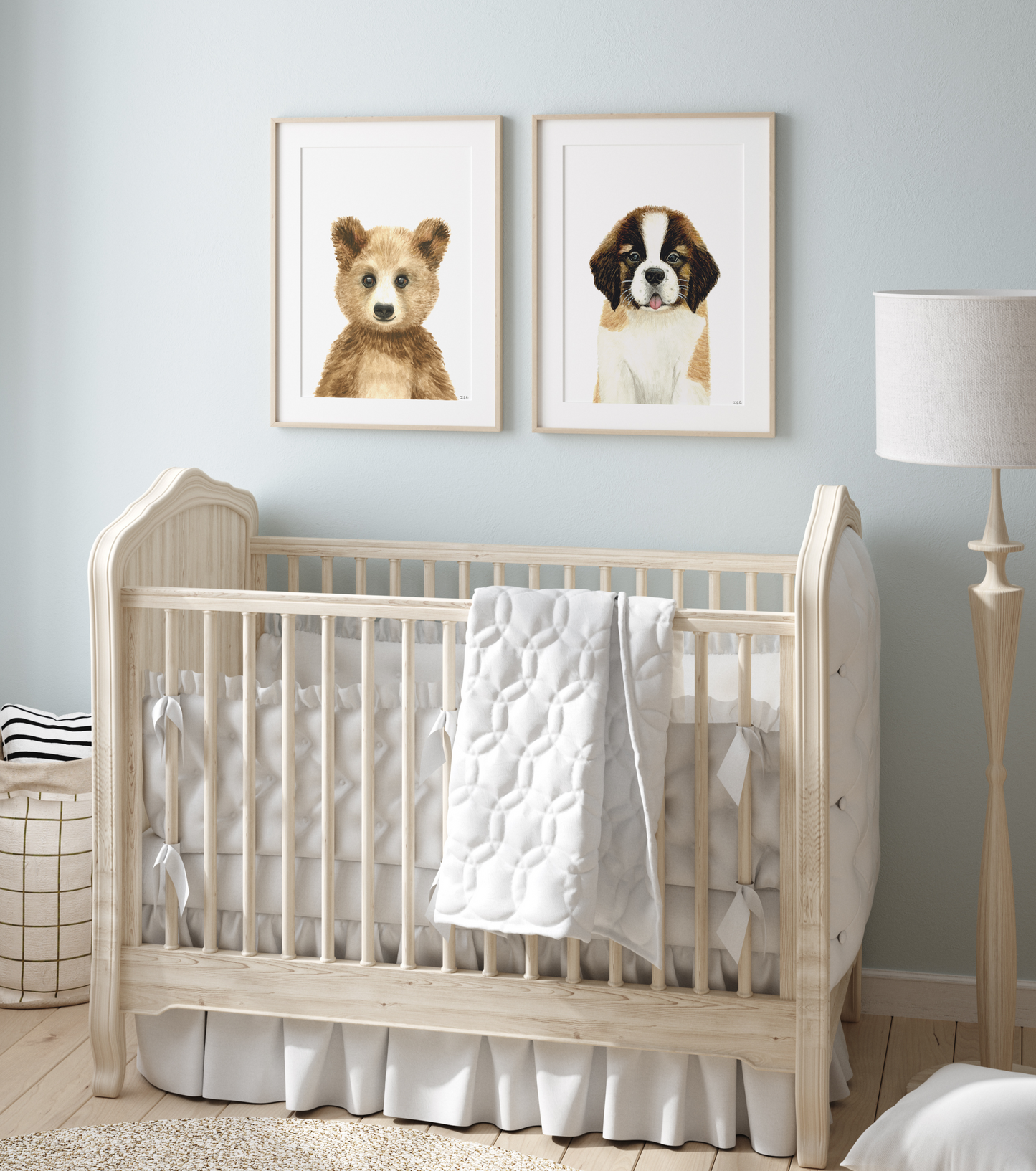 Set of 2 nursery animal prints above baby crib: bear and saint bernard dog