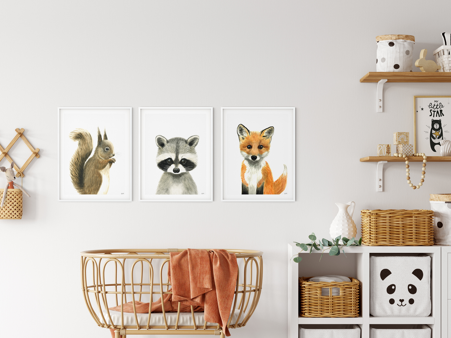 Set of 3 woodland watercolor animal prints in a nursery: squirrel, racoon and fox