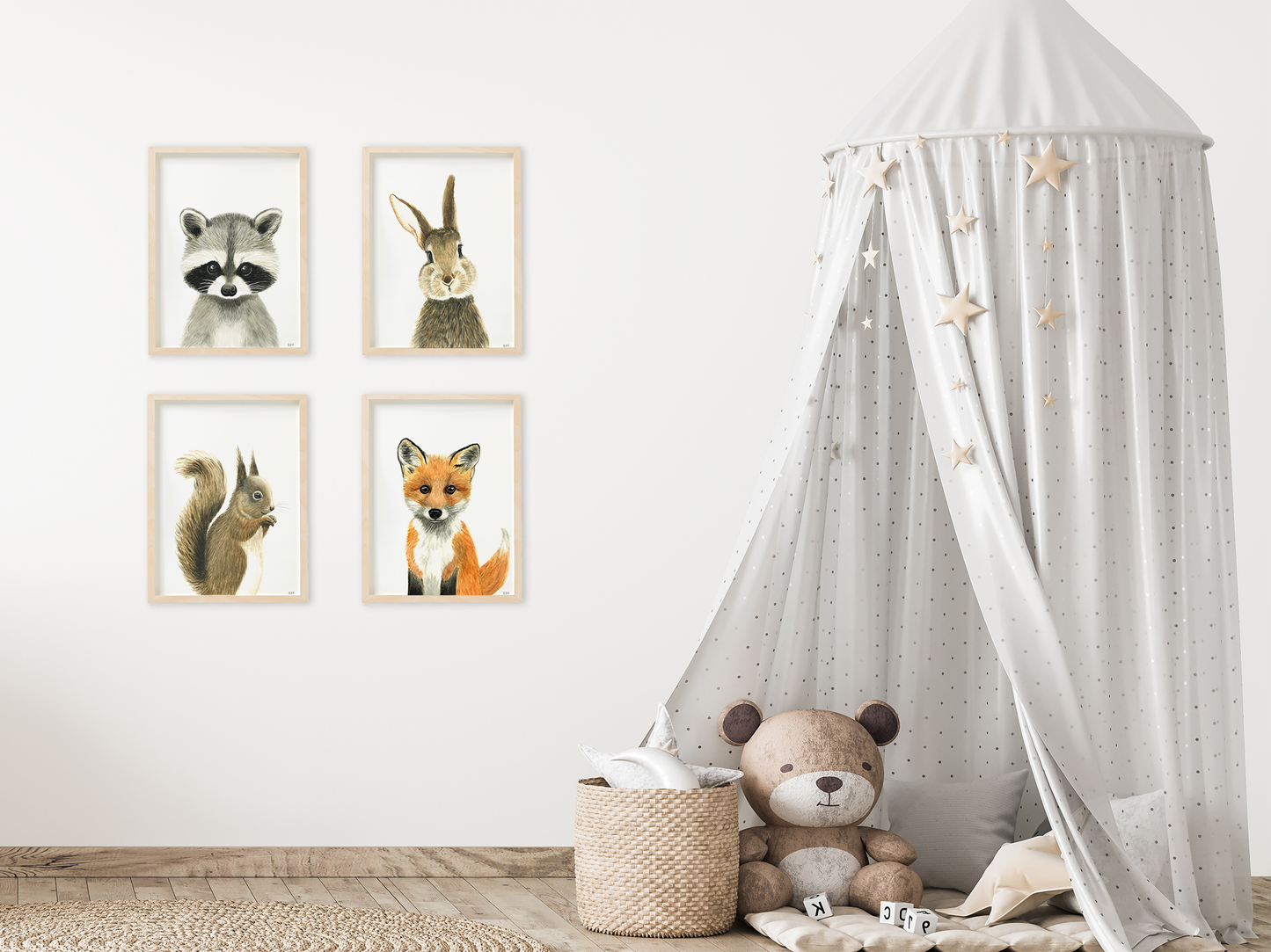 Set of 4 animal wall art prints in a kids' bedroom or nursery: racoon, rabbit, squirrel and fox
