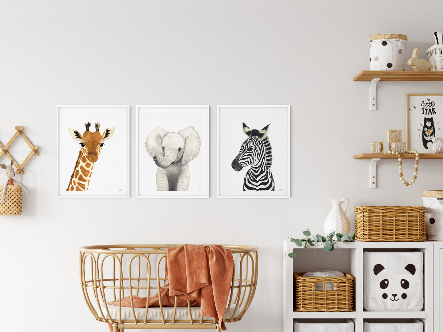 Set of 3 safari animal wall art prints in a babyroom: giraffe, elephant and zebra