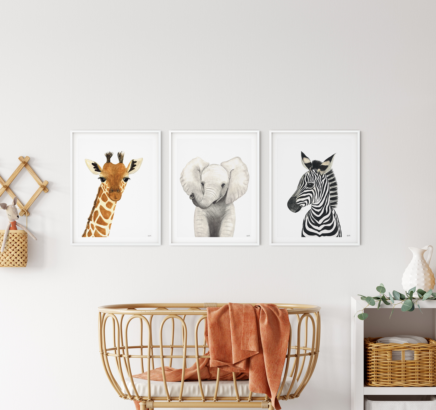 Safari nursery animal prints in a babyroom: giraffe, elephant and zebra