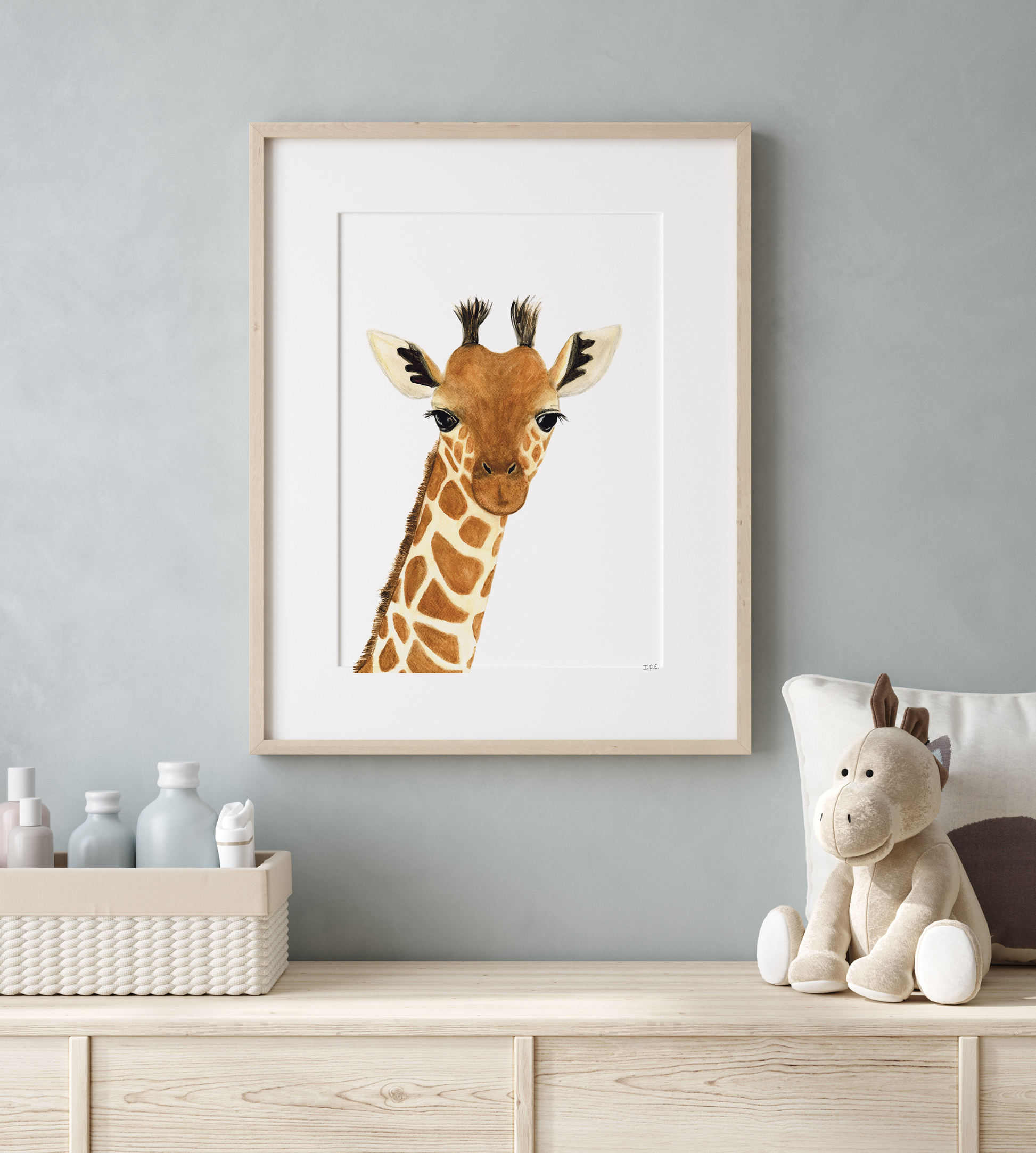 Framed Giraffe in nursery room with decor