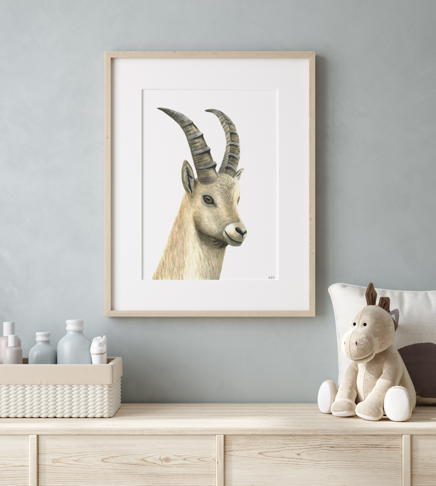 Framed ibex print as nursery decor in a babyroom