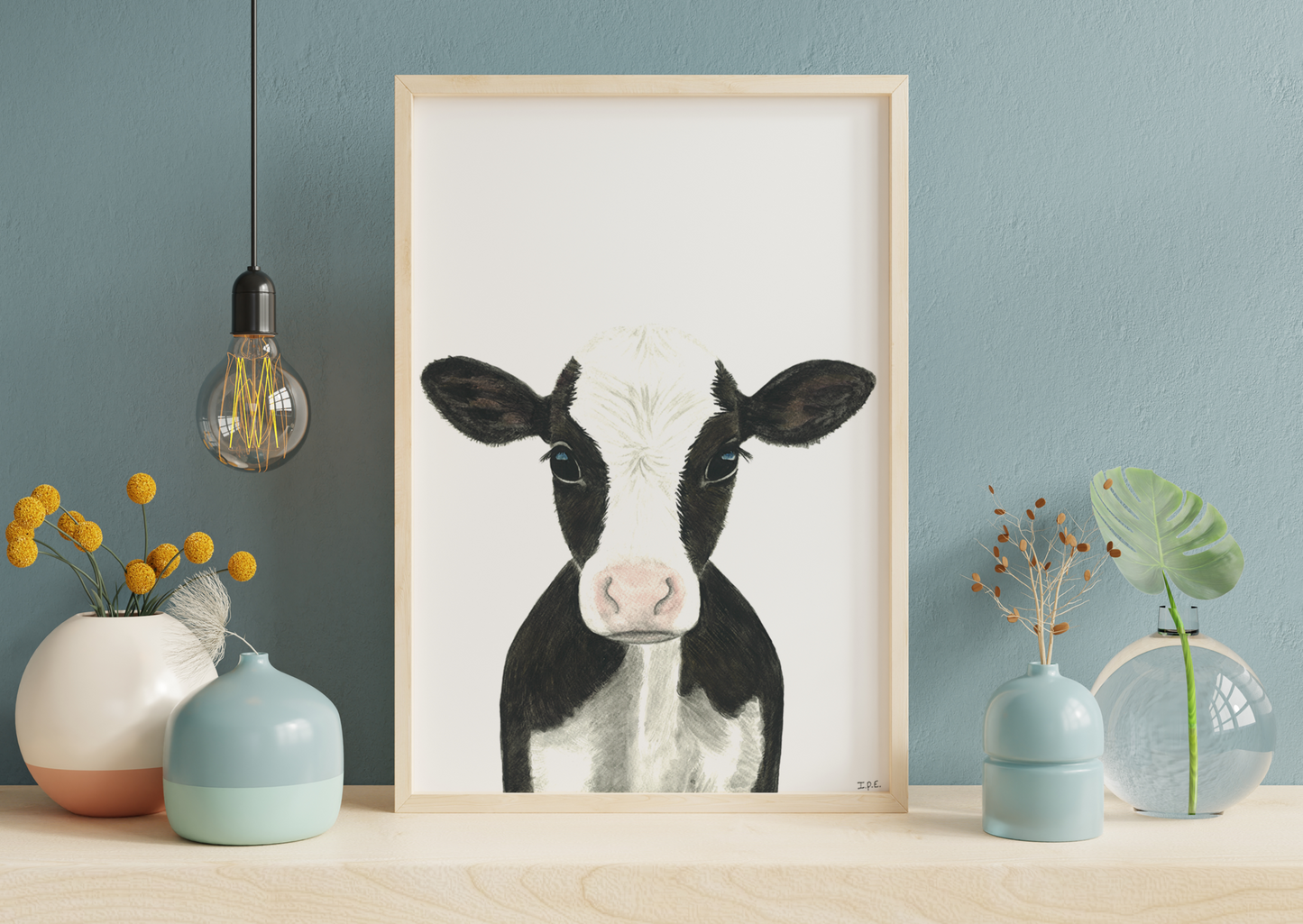 Framed cow print with decoration