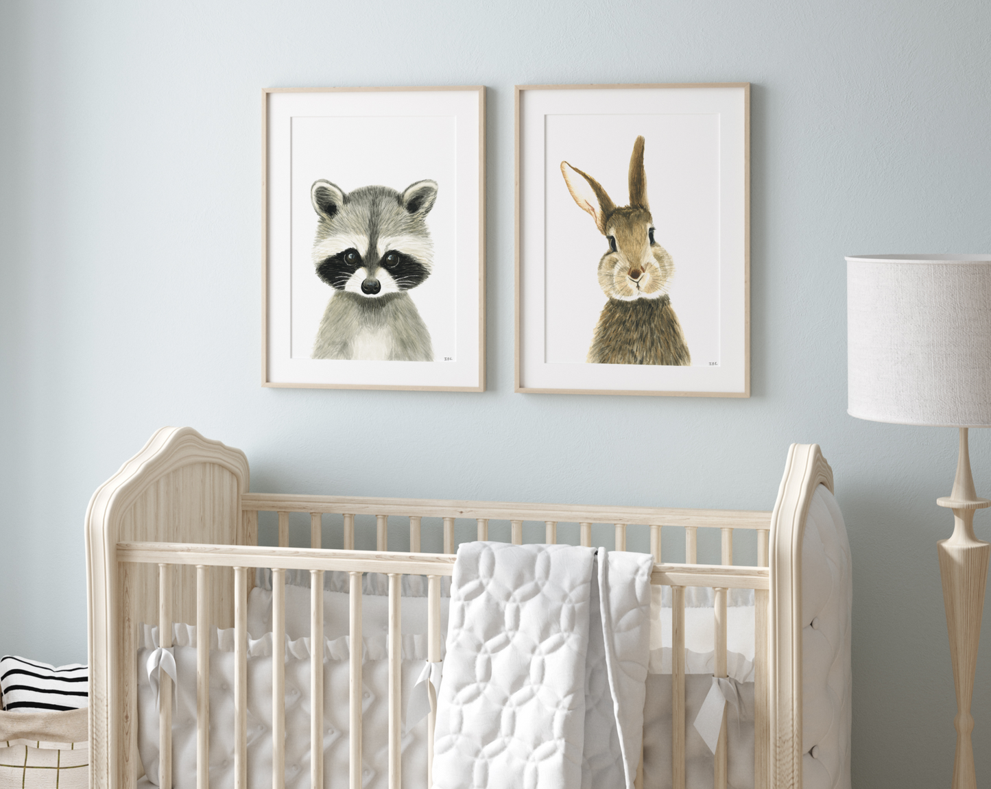 Set of 2 nursery prints in a babyroom: racoon and bunny rabbit