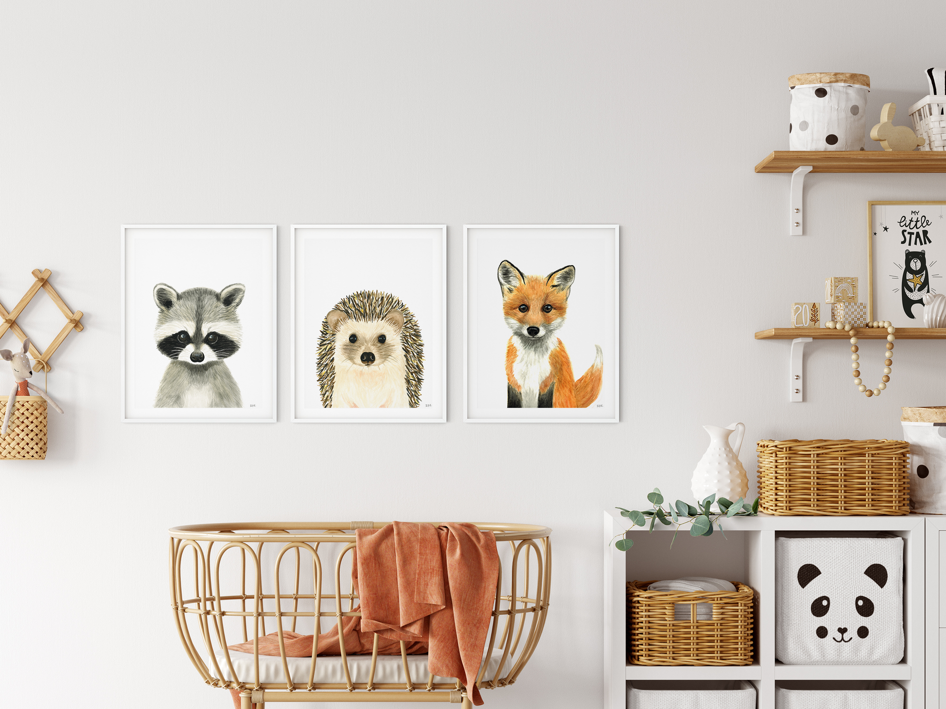 Set of 3 wall art animal prints as decor in a nursery: racoon, hedgehog, fox