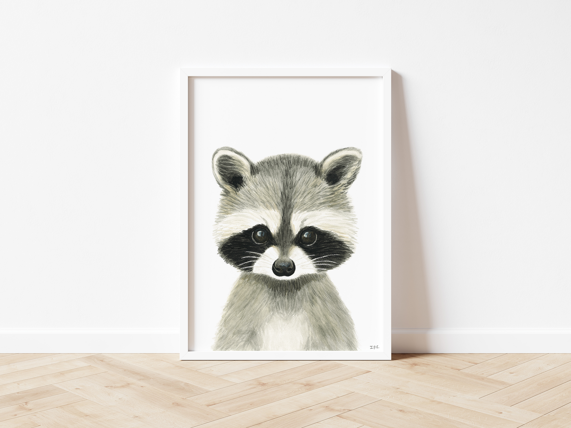 Framed racoon wall art on wooden floor