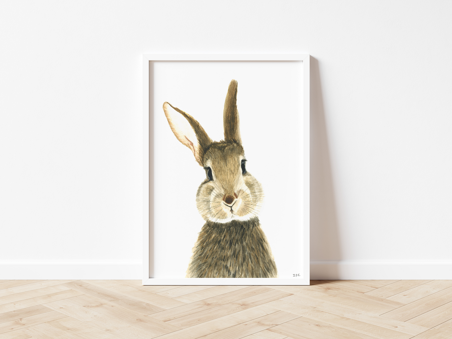 Framed bunny rabbit nursery print on wooden floor